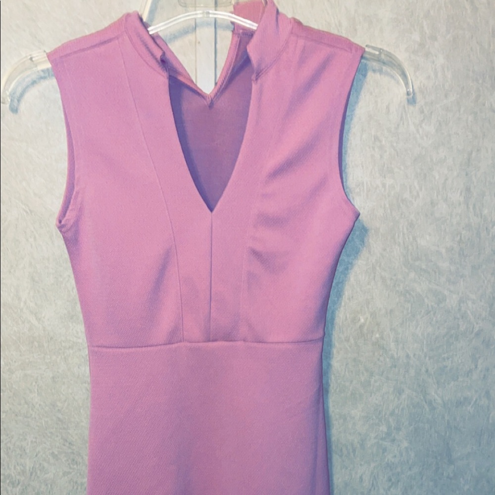 This is a tight fitting dress but does not fit